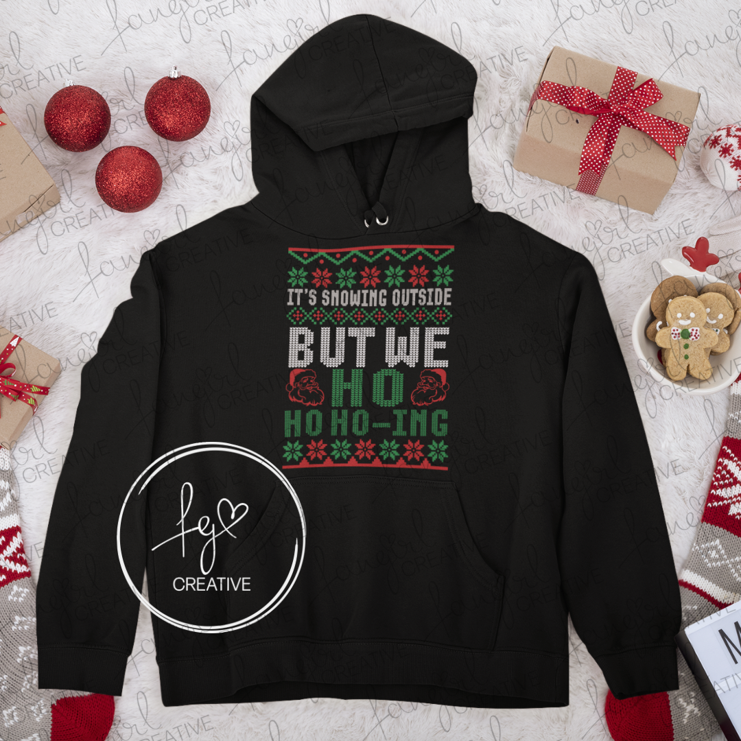 It's Snowing Outside But We Ho Ho Ho-ing Hooded Sweatshirt